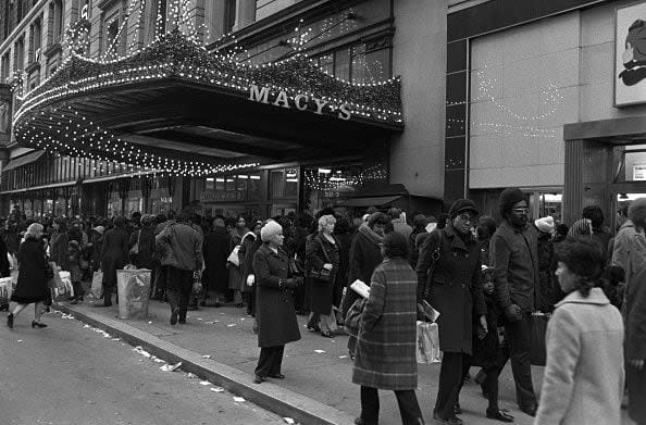 Christmas shoppers outside of Macy's department store (Photo by Fairchild Archive/Penske Media via Getty Images)