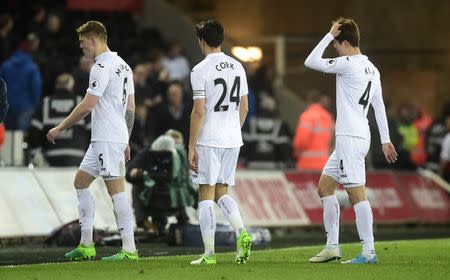 Britain Soccer Football - Swansea City v Tottenham Hotspur - Premier League - Liberty Stadium - 5/4/17 Swansea City's Jack Cork and team mates look dejected after the match Reuters / Rebecca Naden Livepic