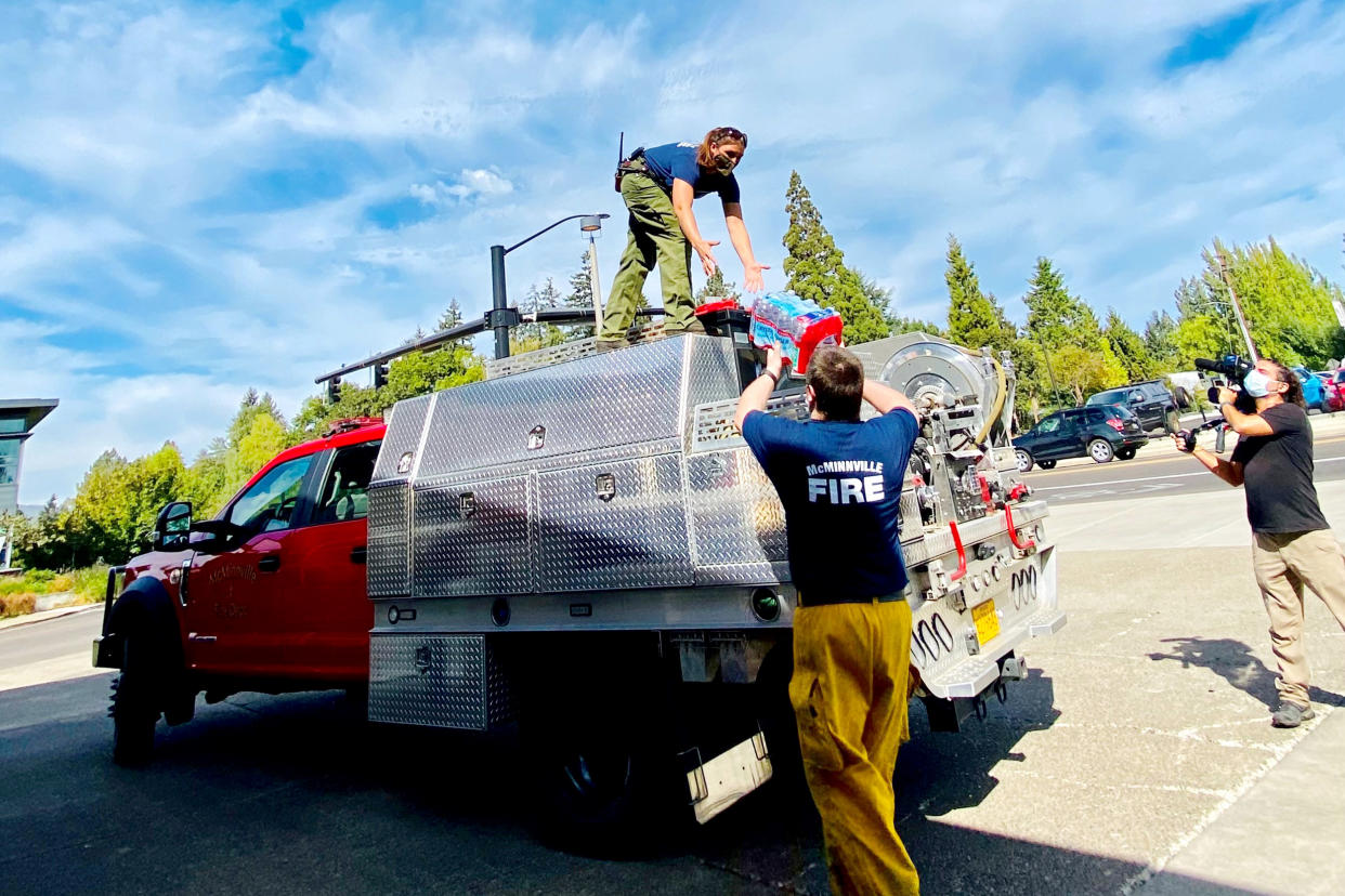 A team of McMinnville firefighters load an engine with gear to deploy to a wildfire in Oregon. (NBC News)