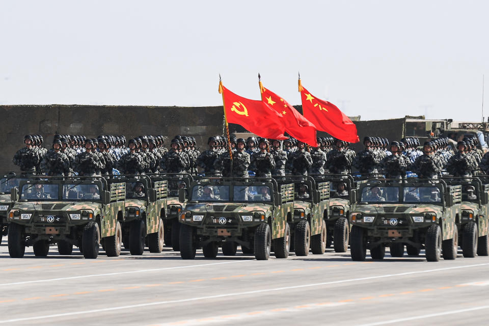 The flag guard formation holding the flag of the Communist Party of China, the national flag and the flag of the People's Liberation Army to mark its 90th birthday in July 2017.