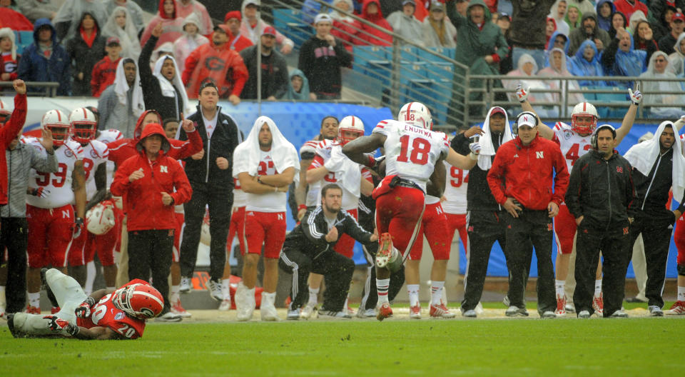 Nebraska wide receiver Quincy Enunwa (18) runs after catching a pass for a 99-yard touchdown reception during the second half of the Gator Bowl NCAA college football game against Georgia, Wednesday, Jan. 1, 2014, in Jacksonville, Fla. Nebraska beat Georgia 24-19. (AP Photo/Stephen B. Morton)