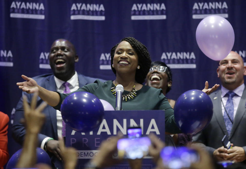 Boston City Councilor Ayanna Pressley, center, celebrates victory over U.S. Rep. Michael Capuano, D-Mass., in the 7th Congressional House Democratic primary, Tuesday, Sept. 4, 2018, in Boston. (AP Photo/Steven Senne)