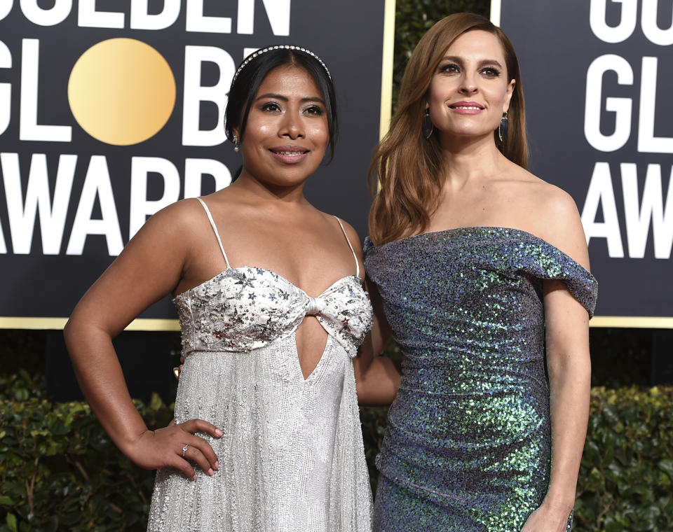 FILE - In this Jan. 6, 2019 file photo, actresses Yalitza Aparicio, left, and Marina de Tavira arrive at the 76th annual Golden Globe Awards in Beverly Hills, Calif. Aparicio and De Tavira portray a domestic worker and her employer, respectively, in the Spanish-language film "Roma." (Photo by Jordan Strauss/Invision/AP, File)