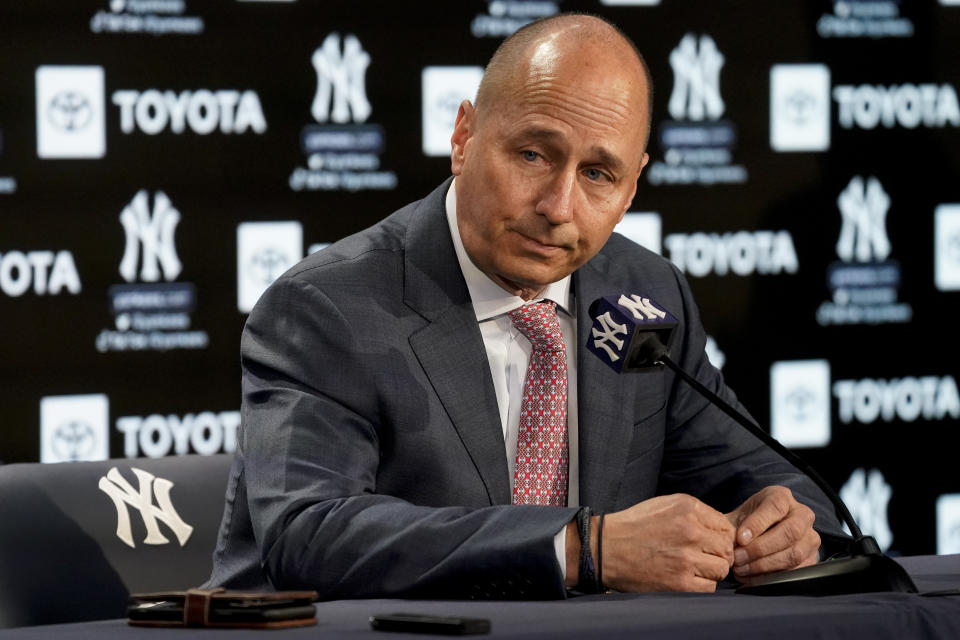 Brian Cashman, general manager and senior vice president of the New York Yankees, announces that the team failed to secure a multi-year deal with right fielder Aaron Judge (99) before their opening day baseball game against the Boston Red Sox, Friday, April 8, 2022, in New York. (AP Photo/John Minchillo)