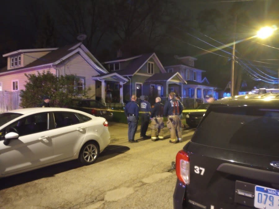 Police outside the scene of a double homicide on Thursday night. (WLNS)