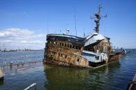 FILE - A partially sunken Ukrainian warship sits in the water in an area of the Mariupol Sea Port in Mariupol, in territory under the government of the Donetsk People's Republic, eastern Ukraine, Friday, April 29, 2022. This photo was taken during a trip organized by the Russian Ministry of Defense. (AP Photo, File)