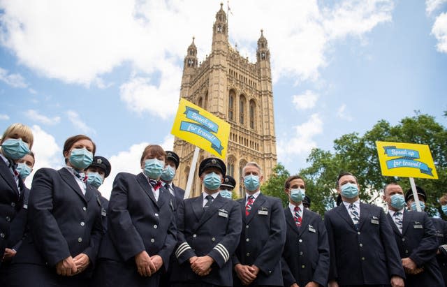 British Airways flight staff and cabin crew join the demonstration (Dominic Lipinski/PA)