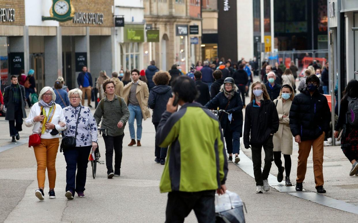 Shoppers in Oxford, which will come under Tier 2 on Saturday  - Steve Parsons/PA