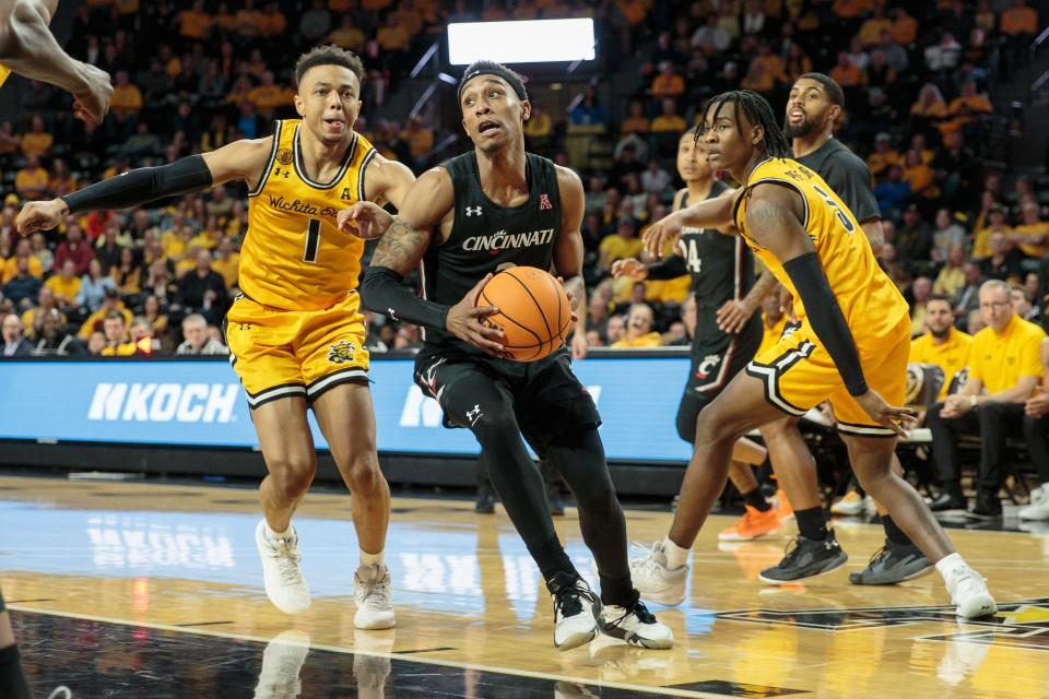 Jan 5, 2023; Wichita, Kansas, USA; Cincinnati Bearcats guard Mika Adams-Woods (3) drives to the basket during the first half against the Wichita State Shockers at Charles Koch Arena.