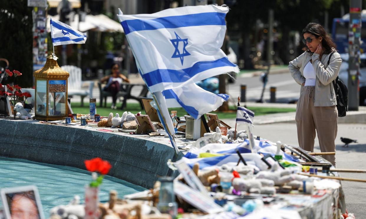 <span>Memorabilia and pictures in Tel Aviv of hostages taken by Hamas in the 7 October attack.</span><span>Photograph: Hannah McKay/Reuters</span>