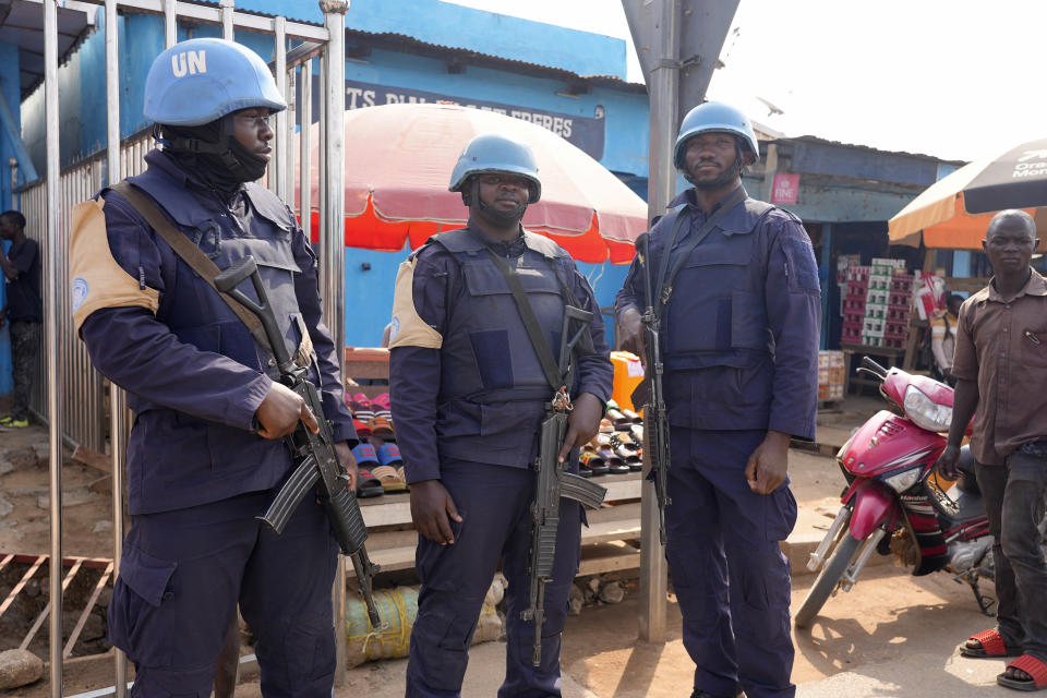 United Nations peacekeepers stand in the market in Bouar, Central African Republic, Friday, March 8, 2024. Nearly 5,000 fighters have put down their arms in Central African Republic since a disarmament program launched nearly a decade ago. Yet former rebels, communities and conflict experts say it's hard to halt fighting in a country still in conflict and where little other paid work exists. (AP Photo/Sam Mednick)