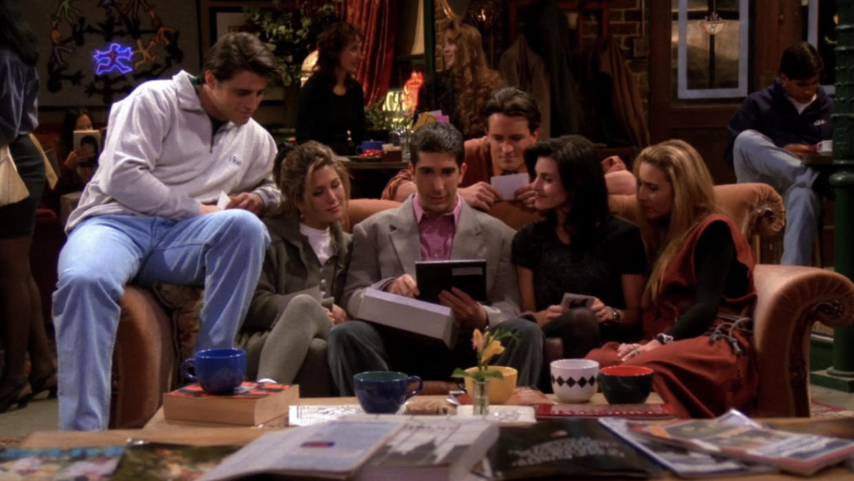  The Friends cast sitting at Central Perk. 