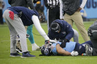 Tennessee Titans tight end MyCole Pruitt is attended to after being injured in the first half of an NFL football game against the Miami Dolphins Sunday, Jan. 2, 2022, in Nashville, Tenn. (AP Photo/James Kenney)