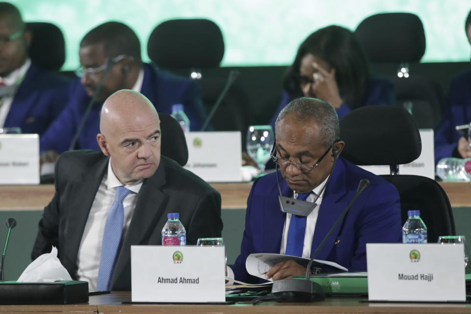 Confederation of African Football president Ahmad Ahmad of Madagascar, right, and FIFA president Gianni Infantino attend the Confederation of African Football general assembly in Cairo, Egypt, Thursday, July 18, 2019. The African soccer body is holding its first major meeting since announcing that FIFA will send a senior official to lead a clean-up of the scandal-plagued organization in an unprecedented move for soccer. The Confederation of African Football, whose president is facing numerous allegations of corruption amid the crisis, is holding its general assembly on Thursday in Cairo on the eve of the African Cup final. (AP Photo/Hassan Ammar)