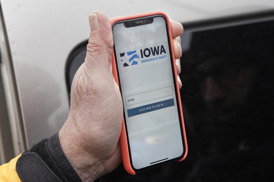 Precinct captain Carl Voss of Des Moines displays the Iowa Democratic Party caucus reporting app on his phone outside of the Iowa Democratic Party headquarters in Des Moines, Iowa, Tuesday, Feb. 4, 2020. (Photo: ASSOCIATED PRESS)