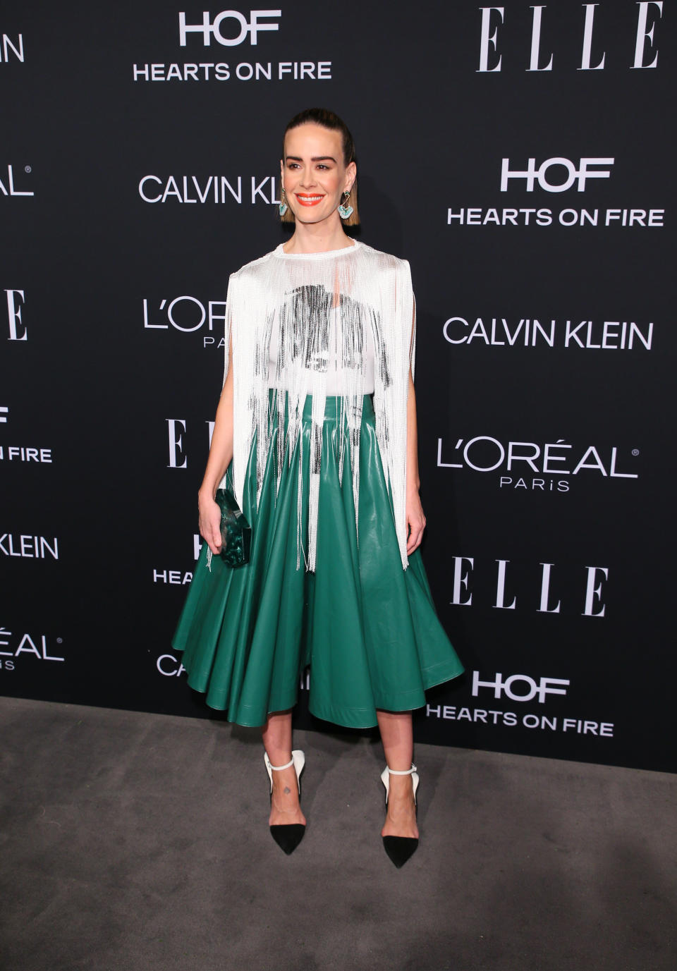 <p>On October 15, Sarah Paulson wore a glitzy Calvin Klein dress for the 25th Annual ELLE Women in Hollywood Celebration. The actress finished the ensemble with slicked back hair and a lick of red lipstick. <em>[Photo: Getty]</em> </p>