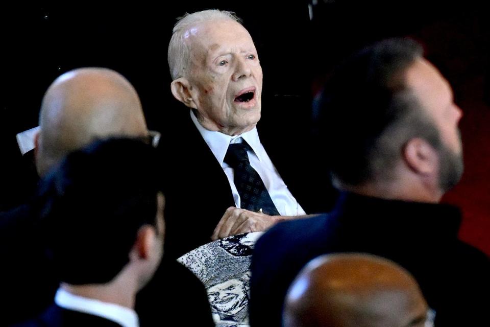 <p>ANDREW CABALLERO-REYNOLDS/AFP via Getty Images</p> Former President Jimmy Carter at the memorial service for his wife of 77 years, Rosalynn Carter, on Nov. 28, 2023