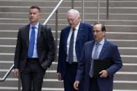 Dallas Cowboys owner Jerry Jones, center, arrives with his attorneys to federal court Monday, June 17, 2024, in Los Angeles. (AP Photo/Damian Dovarganes)