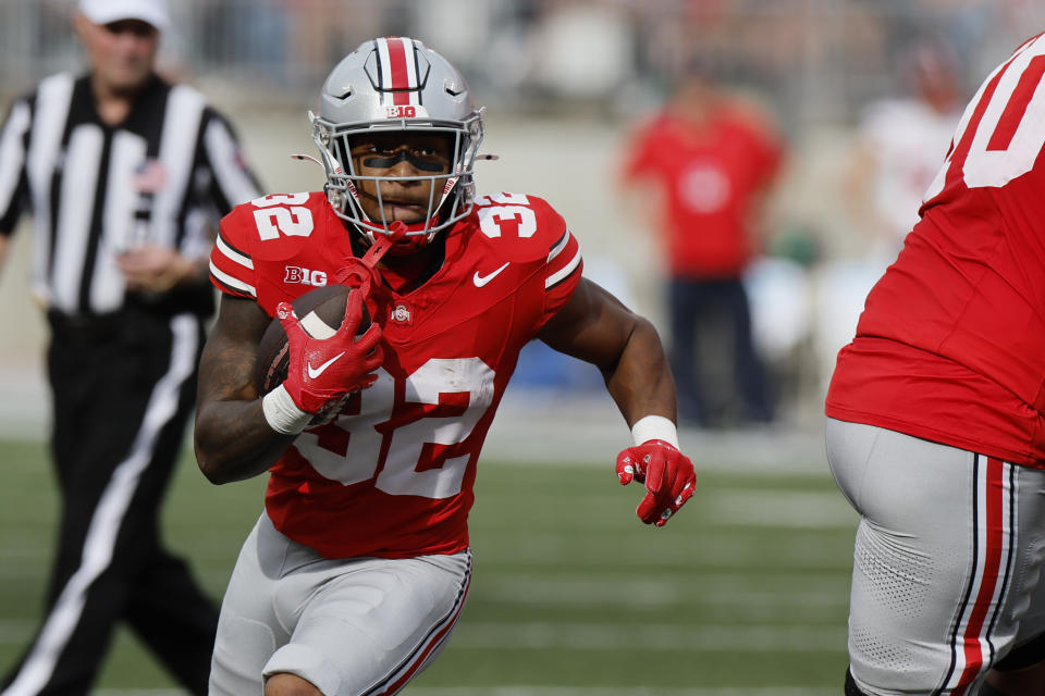 Ohio State running back TreVeyon Henderson runs the ball against Western Kentucky during the first half of an NCAA college football game, Saturday, Sept. 16, 2023, in Columbus, Ohio. (AP Photo/Jay LaPrete)