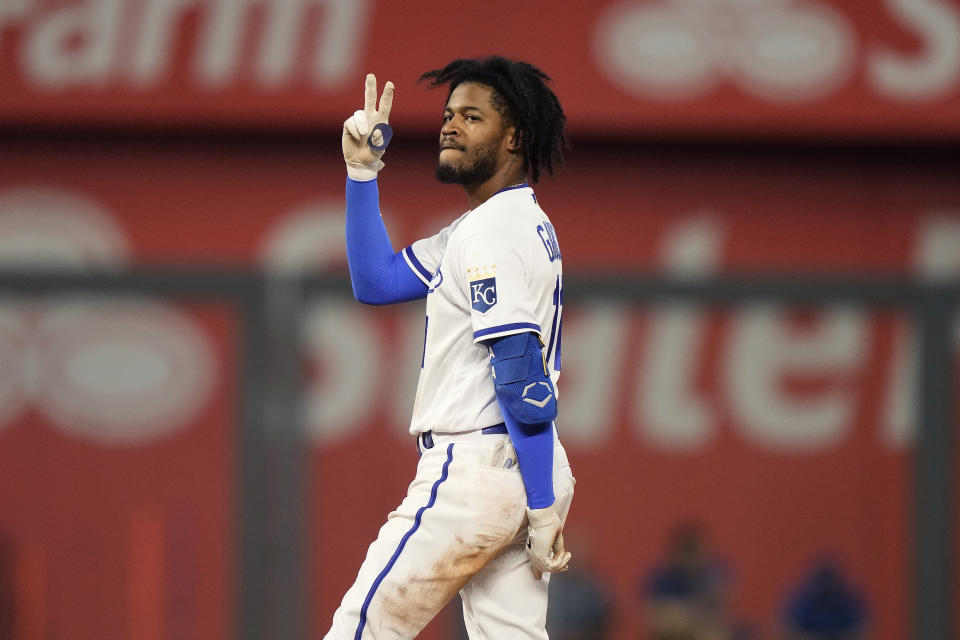 Kansas City Royals' Maikel Garcia celebrates on second after hitting a two-run double during the sixth inning of a baseball game against the Detroit Tigers Tuesday, July 18, 2023, in Kansas City, Mo. (AP Photo/Charlie Riedel)