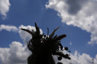 A race fan walks through the stands at Churchill Downs before the 150th running of the Kentucky Derby horse race Saturday, May 4, 2024, in Louisville, Ky. (AP Photo/Brynn Anderson)