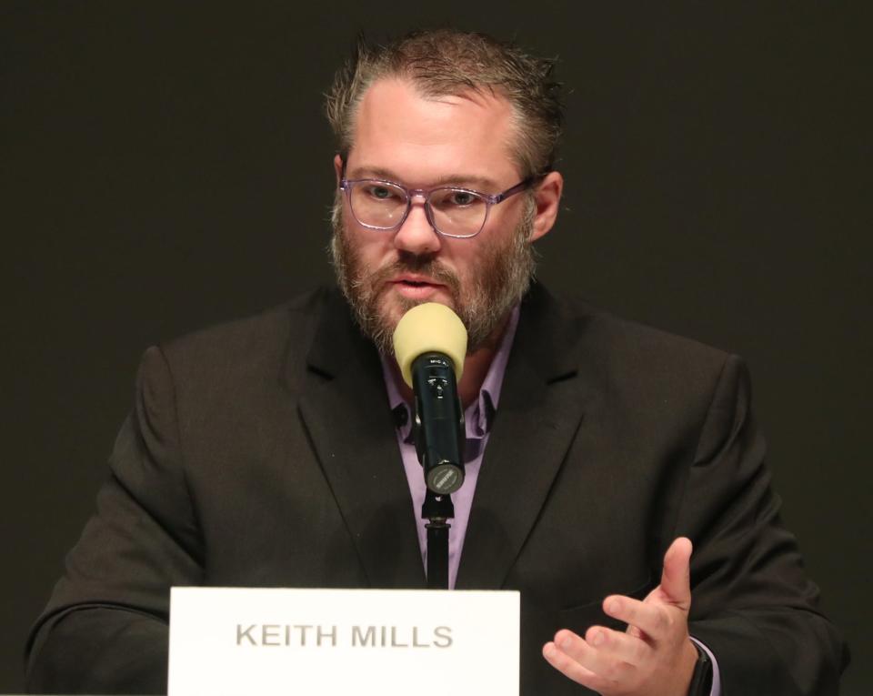 School board candidate Keith Mills answers a question during the Akron City School Board Candidate Forum at the Akron-Summit County Library in Akron.