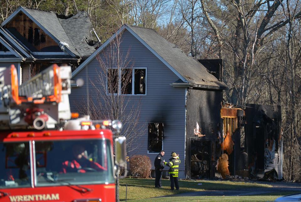 Firefighters and police on the scene following a domestic incident and fire at 11 Grace Lane in Franklin, Dec. 17, 2021.