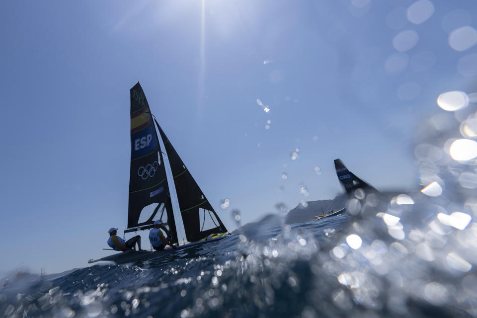 Olympic sailing ready to start with fast windsurfing, birdlike skiffs