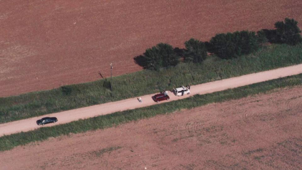 Tiffany Johnston's partially clothed body is discovered on July 27, 1997, a day after her disappearance in tall grass next to an unpaved rural road close to the interstate.  / Credit: Oklahoma County District Attorney's Office