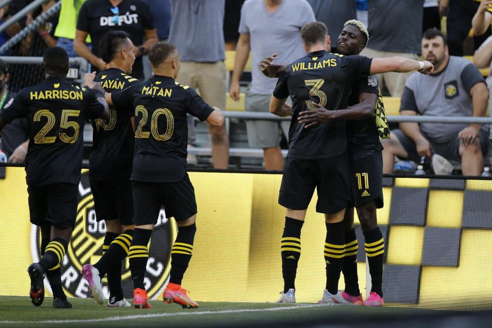 Columbus Crew players celebrate their goal against the Chicago Fire during the first half of an MLS soccer match Saturday, June 19, 2021, in Columbus, Ohio. (AP Photo/Jay LaPrete)