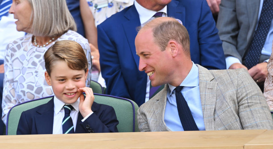 Prince George and Prince William sharing a laugh at the Wimbledon Men's Singles final in 2022. (Getty Images)