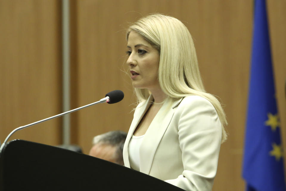 Newly elected Cypriot President of parliament Annita Demetriou addresses to the parliament after her elected in capital Nicosia, Cyprus, Thursday, June 10, 2021. Cyprus' lawmakers elected Demetriou to the country's second most powerful political post since its founding as an independent republic in 1960, in a move seen as a major step in leveling the political playing field for women who have been traditionally under-represented in politics. (AP Photo/Philippos Christou)