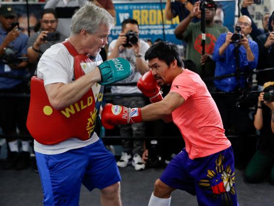 Pacquiao has reunited with trainer Freddie Roach for the bout (AP)