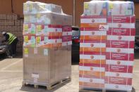 Workers from Doctors Without Borders unload emergency medical supplies to deal with an Ebola outbreak in Conakry, Guinea, March 23, 2014. (REUTERS/Saliou Samb)