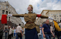 <p>A performer dressed in a historical uniform takes part in a re-enactment festival which coincides with an anti-corruption protest organised by opposition leader Alexei Navalny, on Tverskaya Street in central Moscow, Russia, June 12, 2017. (Maxim Shemetov/Reuters) </p>