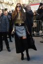 <p>Izabel Goulart appeared ready for a red carpet in thigh-high boots, a long coat, and a mini skirt. <em>(Photo: Getty Images)</em> </p>