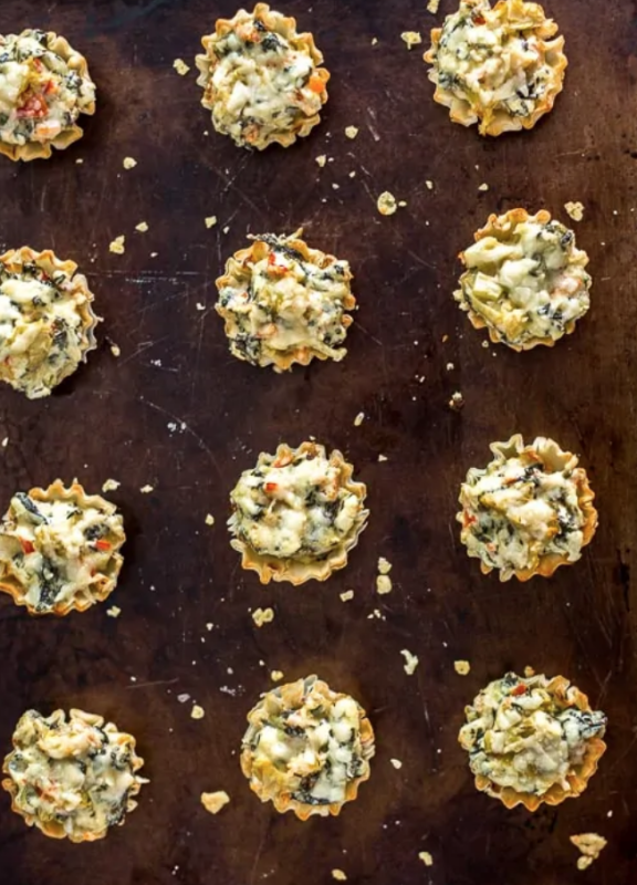 <p>Plating Pixels</p><p>These mini parmesan spinach phyllo cup appetizers make entertaining easy. Crisp phyllo cups filled with Parmesan spinach dip, bell peppers, artichoke hearts and Parmesan cheese.</p><p><strong>Get the recipe: <a href="https://www.platingpixels.com/mini-parmesan-spinach-phyllo-cup-appetizers/" rel="nofollow noopener" target="_blank" data-ylk="slk:Mini Parmesan Spinach Phyllo Cup Appetizers;elm:context_link;itc:0;sec:content-canvas" class="link "><em>Mini Parmesan Spinach Phyllo Cup Appetizers</em></a></strong></p>