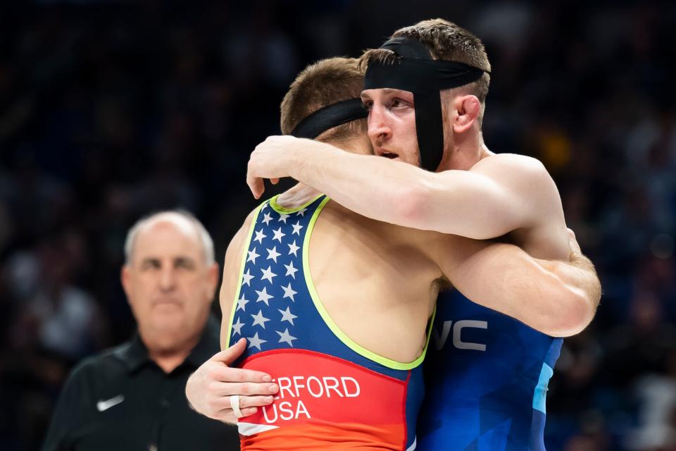 Nick Lee (right) and Zain Retherford embrace after wrestling in the 65 kilogram best-of-three championship series during the U.S. Olympic Team Trials at the Bryce Jordan Center April 20, 2024, in State College. Retherford won the series, 2-0.