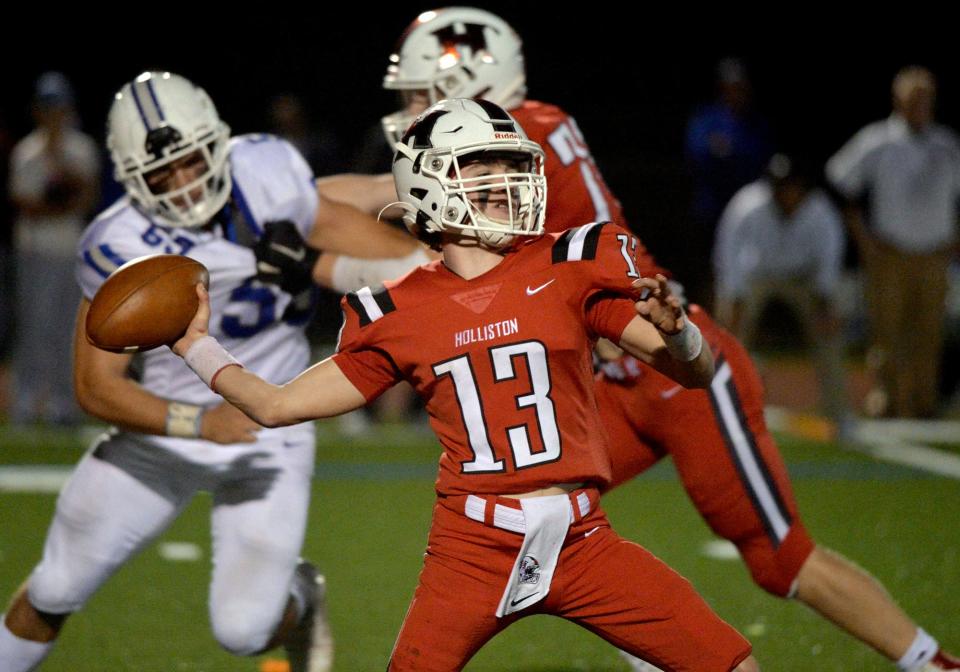 Holliston High School quarterback junior TJ Kiley throws against Ashland, October 8, 2021.