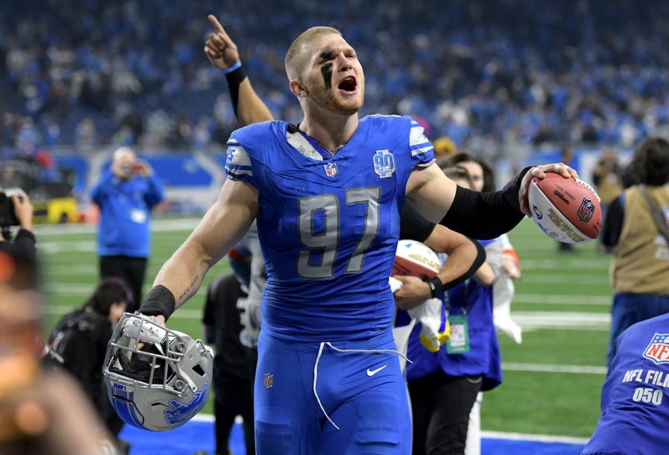 Jan 14, 2024; Detroit, Michigan, USA; Detroit Lions defensive end Aidan Hutchinson (97) celebrates after a 2024 NFC wild card game against the Los Angeles Rams at Ford Field. Mandatory Credit: Lon Horwedel-USA TODAY Sports