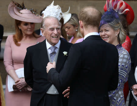 The Duke of Edinburgh talks to the Duke of Sussex as they leave after the wedding of Lady Gabriella Windsor and Thomas Kingston at St George's Chapel in Windsor Castle, near London, Britain May 18, 2019. Steve Parsons/Pool via REUTERS