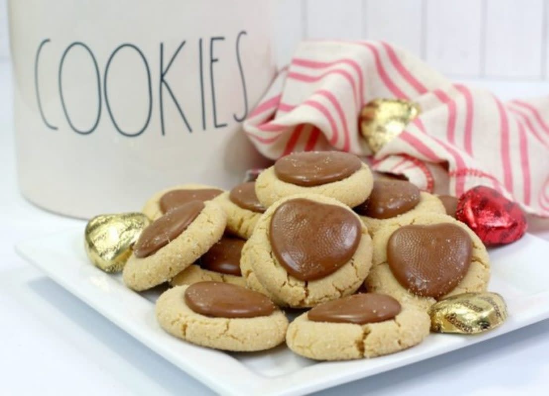 <p>Parade</p><p>Heart-shaped chocolate is nestled into peanut butter cookies for a cute Valentine's Day's treat.</p><p><strong>Get the recipe: <a href="/1155093/pambeth/chocolate-sweetheart-peanut-butter-cookies/" data-ylk="slk:Chocolate Sweetheart Peanut Butter Cookies;elm:context_link;itc:0;sec:content-canvas" class="link rapid-noclick-resp">Chocolate Sweetheart Peanut Butter Cookies</a></strong></p>