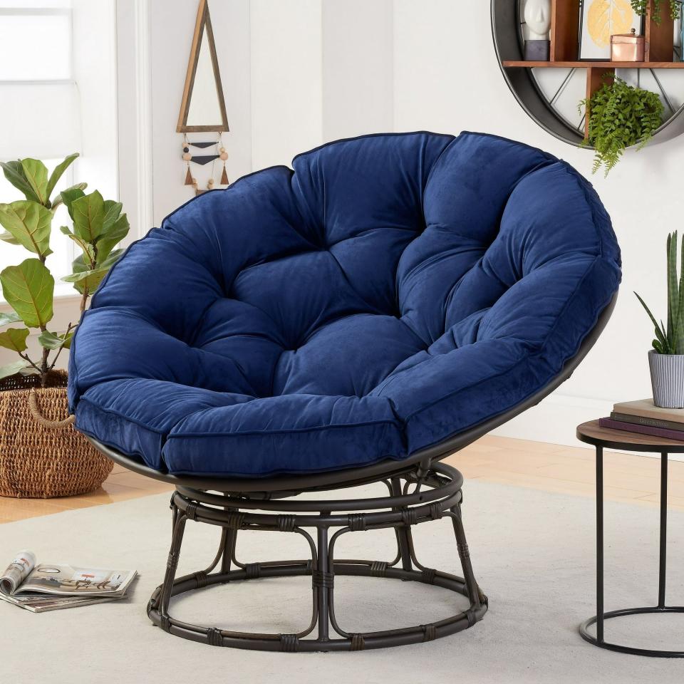 circular chair with tufted cushions in the bedroom