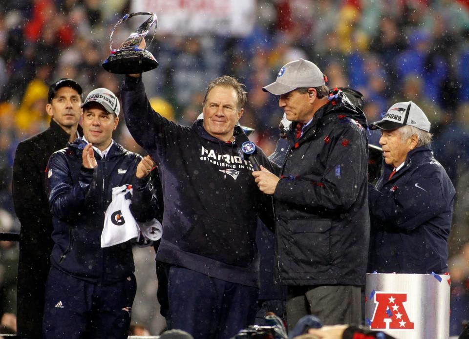 Patriots head coach Bill Belichick celebrates with the Lamar Kraft Trophy while being interviewed by CBS announcer Jim Nantz after the New England Patriots beat the Indianapolis Colts in the AFC Championship Game at Gillette Stadium.