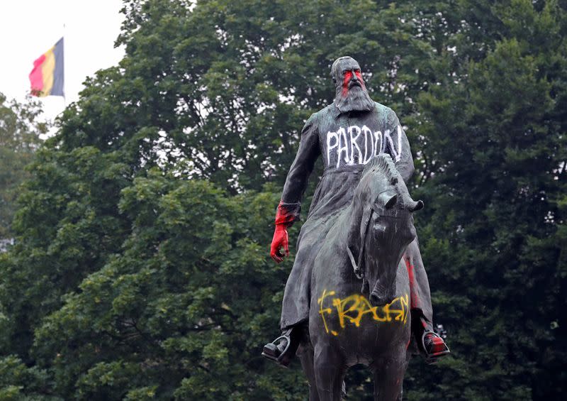 A statue of former Belgian King Leopold II, a controversial figure in the history of Belgium, is seen sprayed with graffiti in Brussels