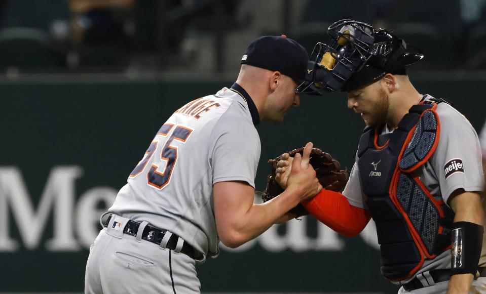 Alex Lange #55 of the Detroit Tigers celebrates with teammate Jake Rogers #34 after the Tigers defeated the Texas Rangers 8-5 at Globe Life Field on June 29, 2023 in Arlington, Texas.