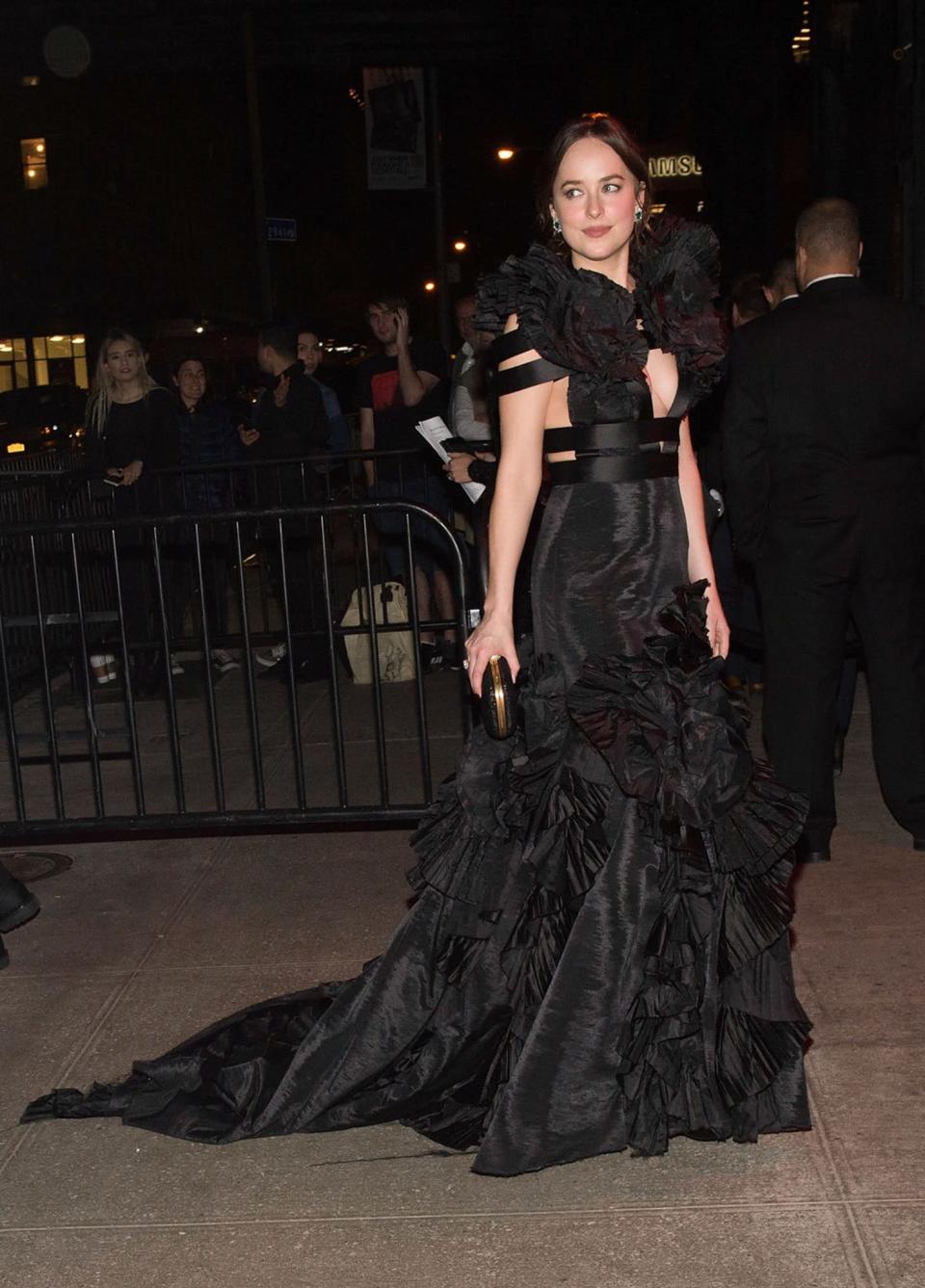 <p>Dakota didn’t change out of her gothic Gucci gown.<br><i>[Photo: Getty]</i> </p>