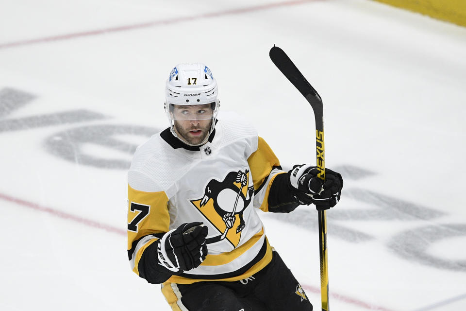 Pittsburgh Penguins right wing Bryan Rust celebrates his goal during the first period of the team's NHL hockey game against the Washington Capitals, Saturday, May 1, 2021, in Washington. (AP Photo/Nick Wass)