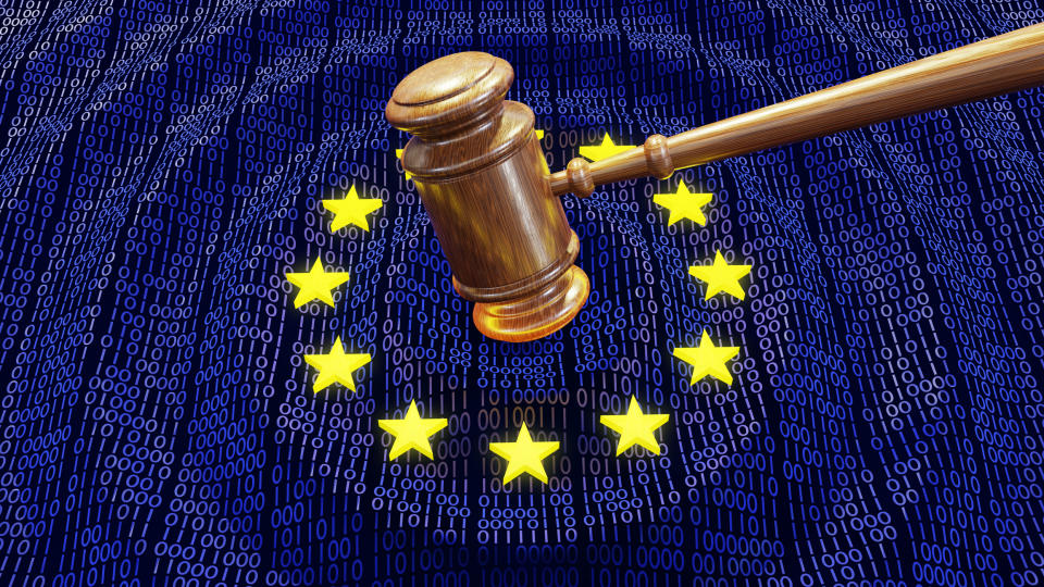 A gavel striking the EU flag with 1s and 0s