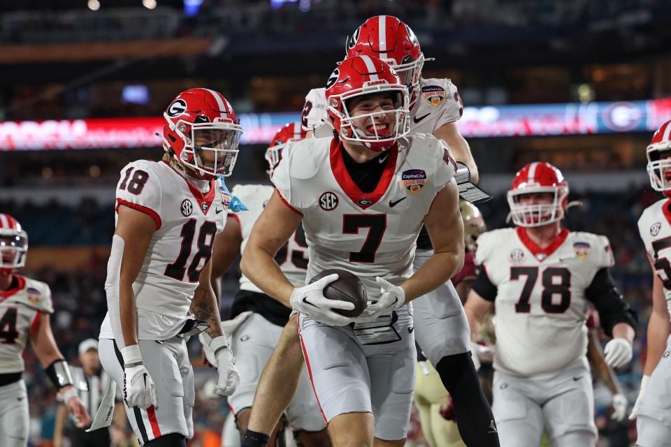 Georgia tight end Lawson Luckie (7) celebrates after scoring a touchdown against Florida State during the second half in the 2023 Orange Bowl at Hard Rock Stadium.